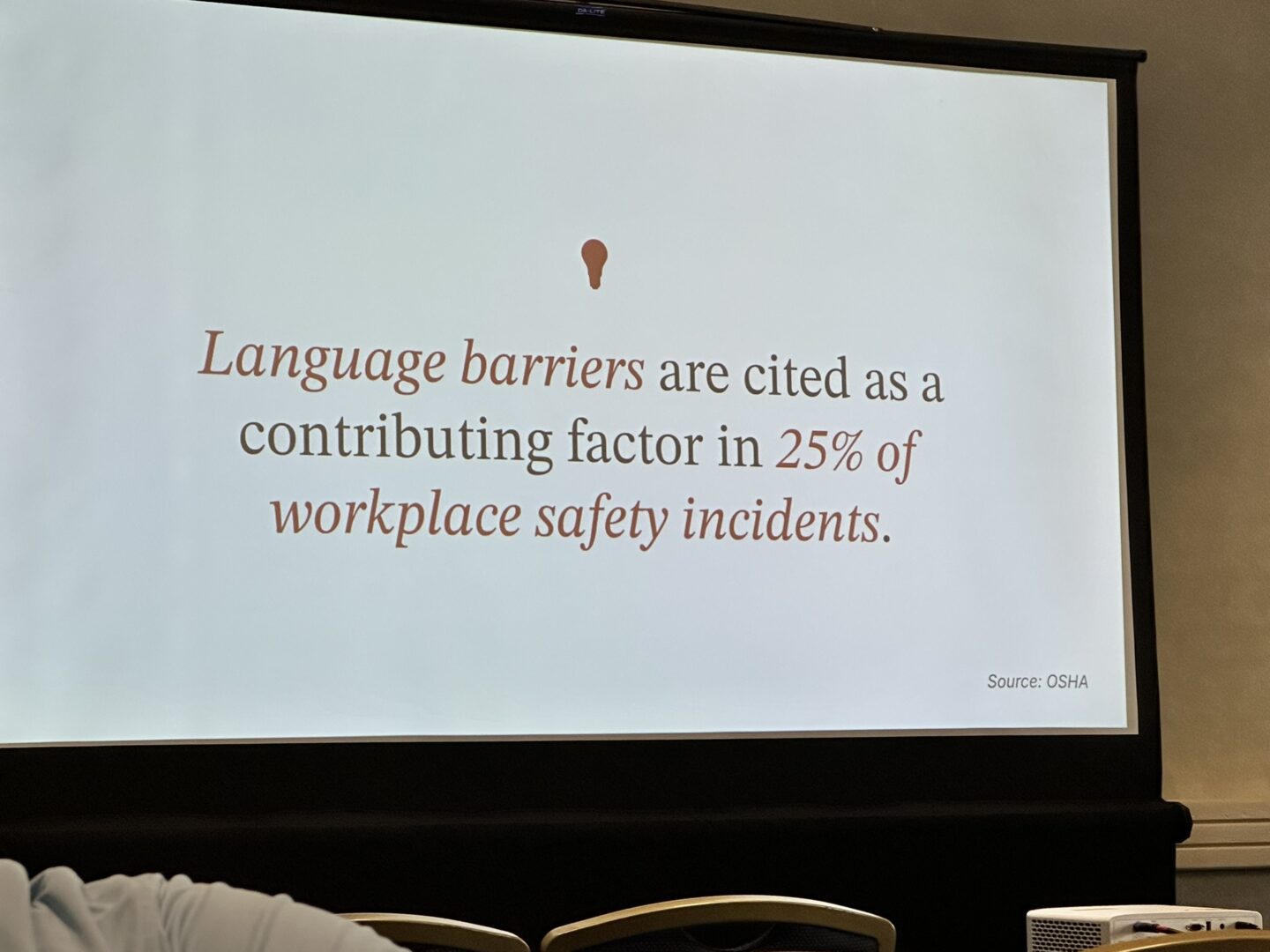 Presentation slide at Training Conference showing language barriers in workplace training